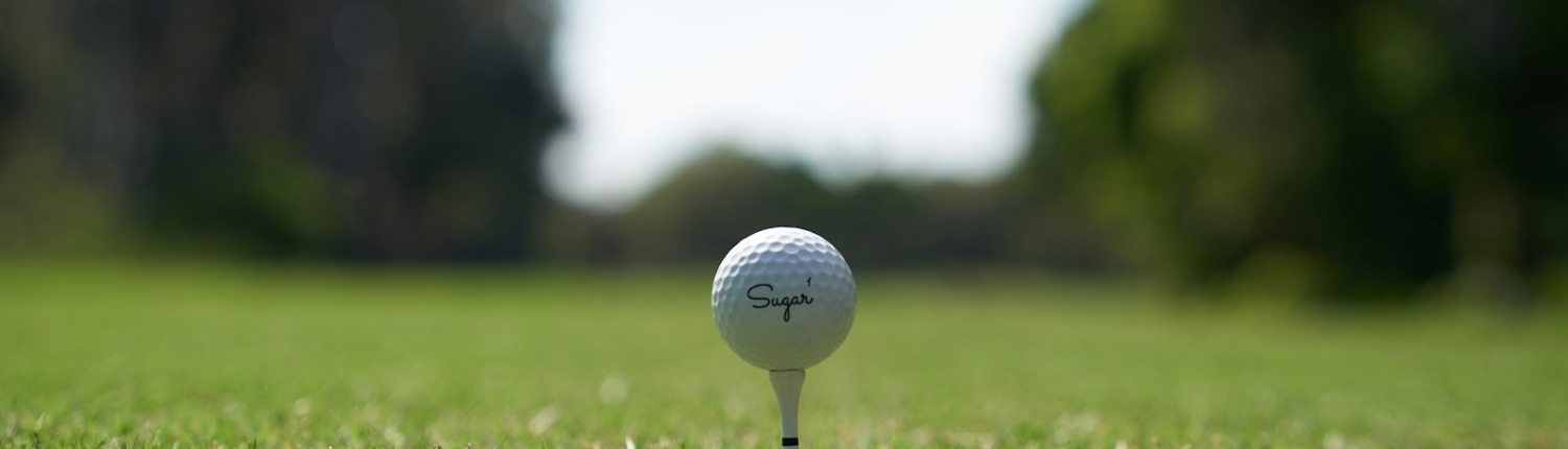 white golf ball on green grass field during daytime
